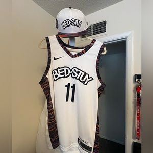 3 Kyrie Irving jerseys size Large and 3 nets hats